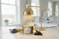 Lavender Truffle 2oz Flameless gold tin under warming lamp